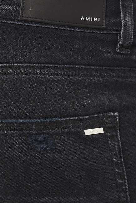 بنطال جينز بتطريز شعار بألوان مائية