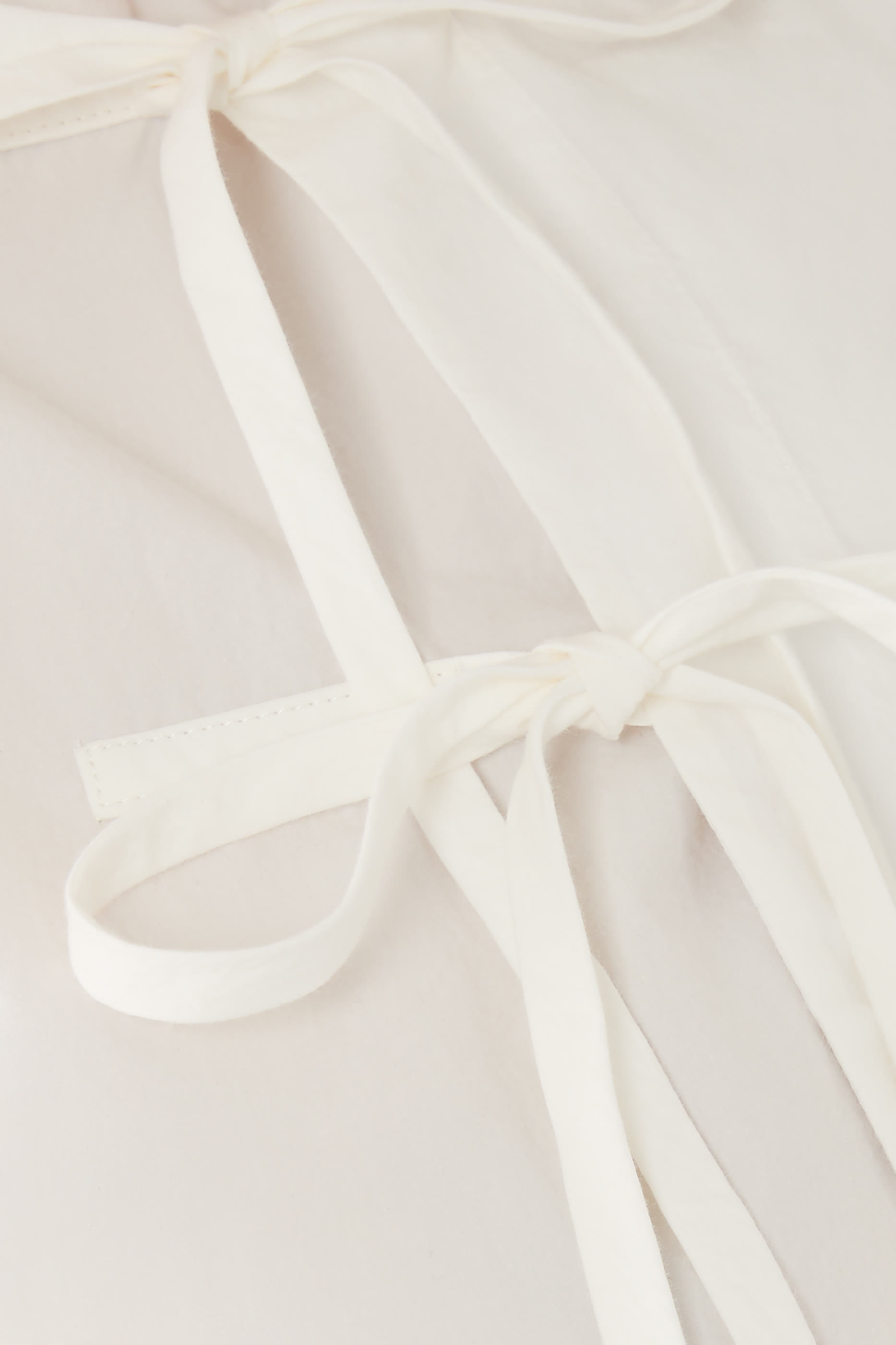 بلوزة كيوتو بربطة في الأمام