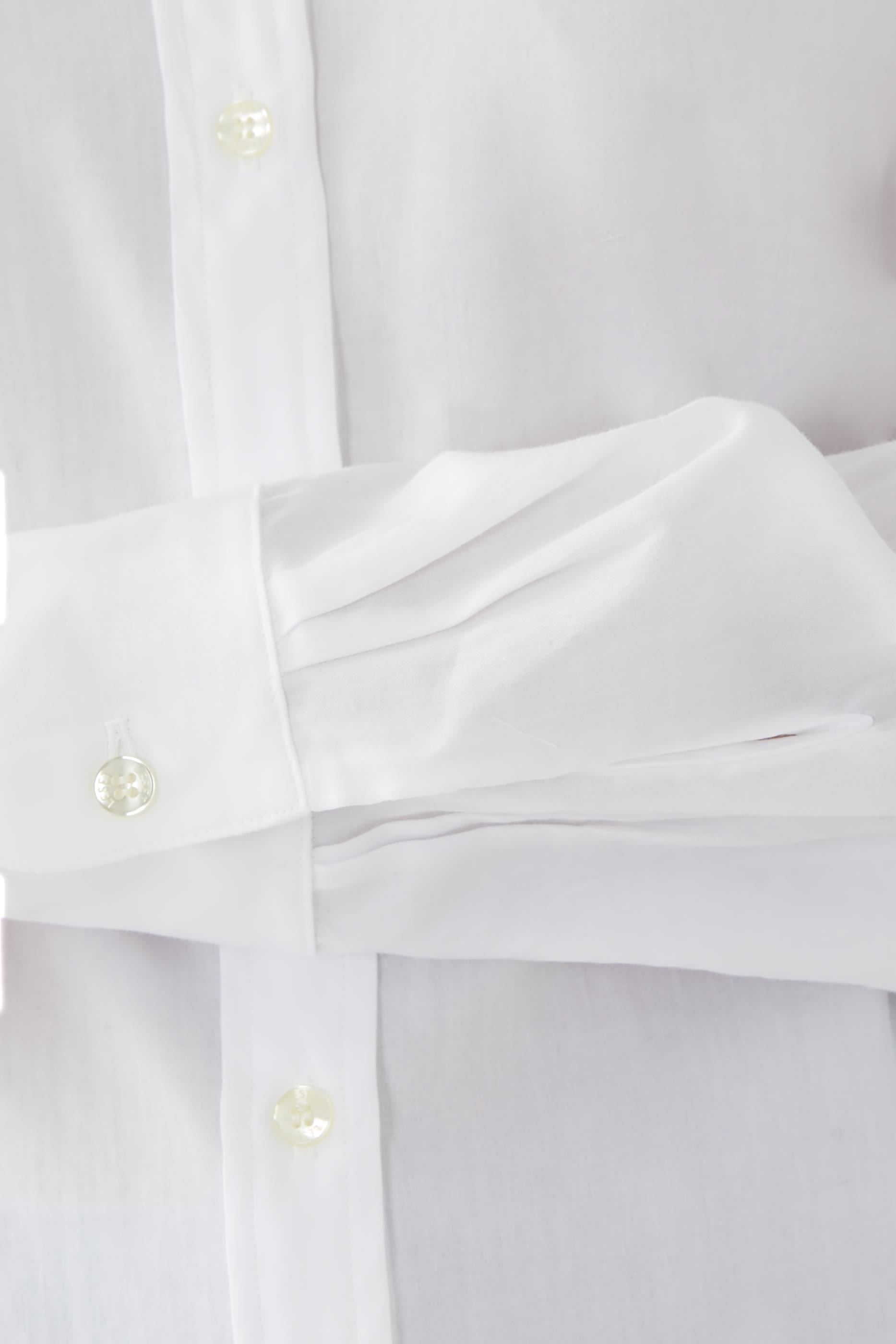 قميص يوكو بقصة واسعة وأزرار