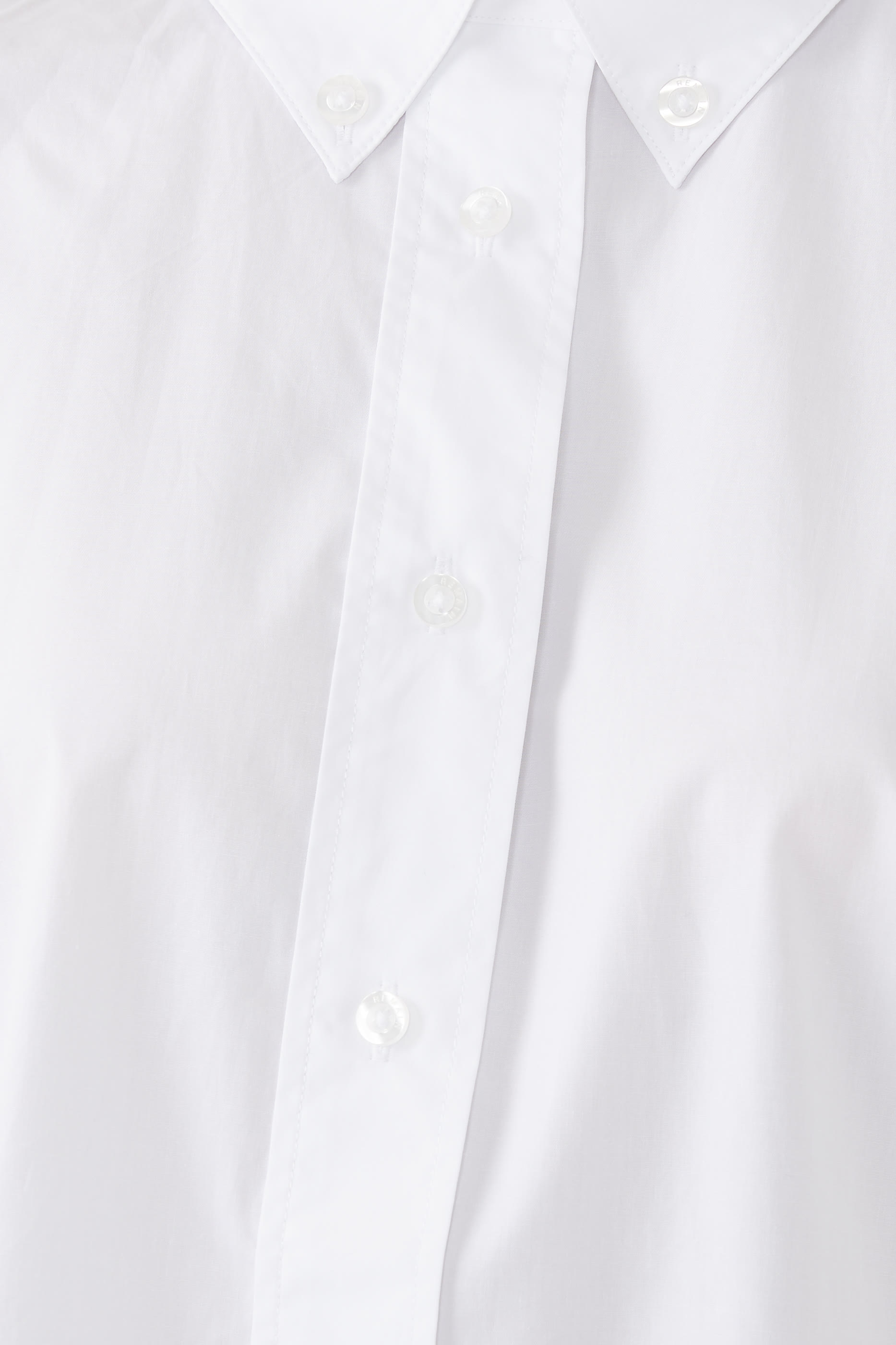 قميص بقصة فضفاضة