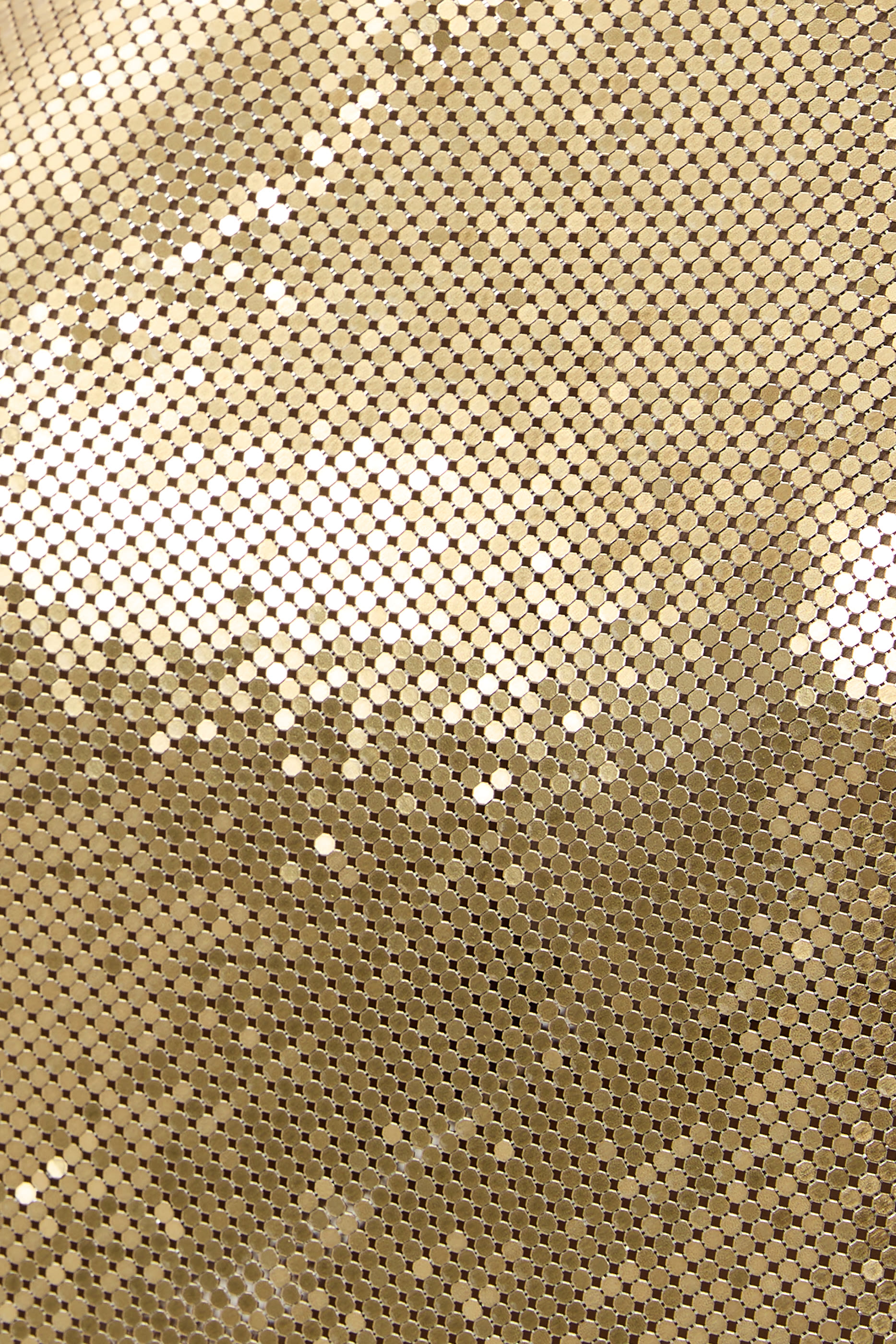 تنورة قصيرة بلون ذهبي قماش شبكي