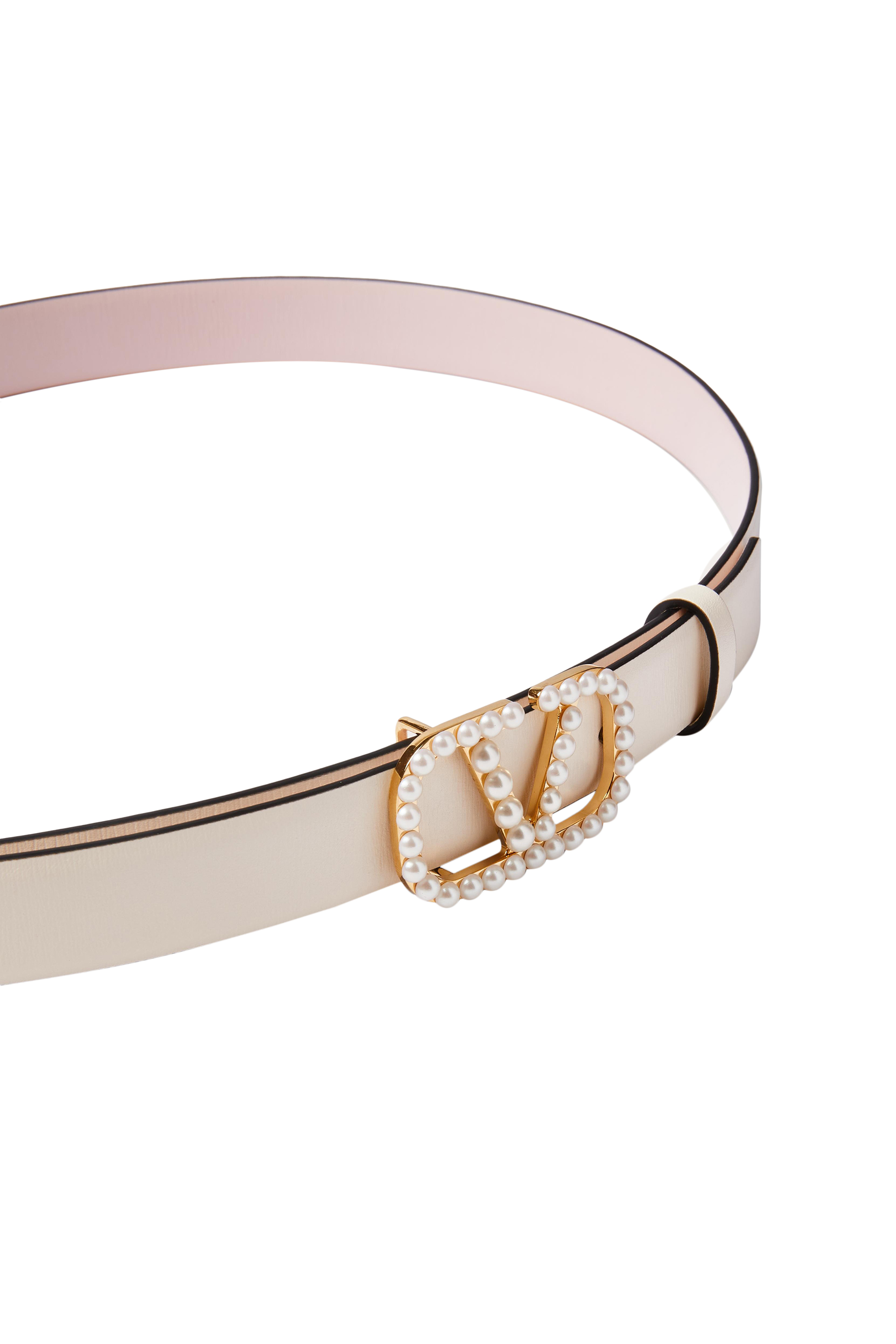 حزام بتصميم وجهين وحلية شعار الماركة بلؤلؤ
