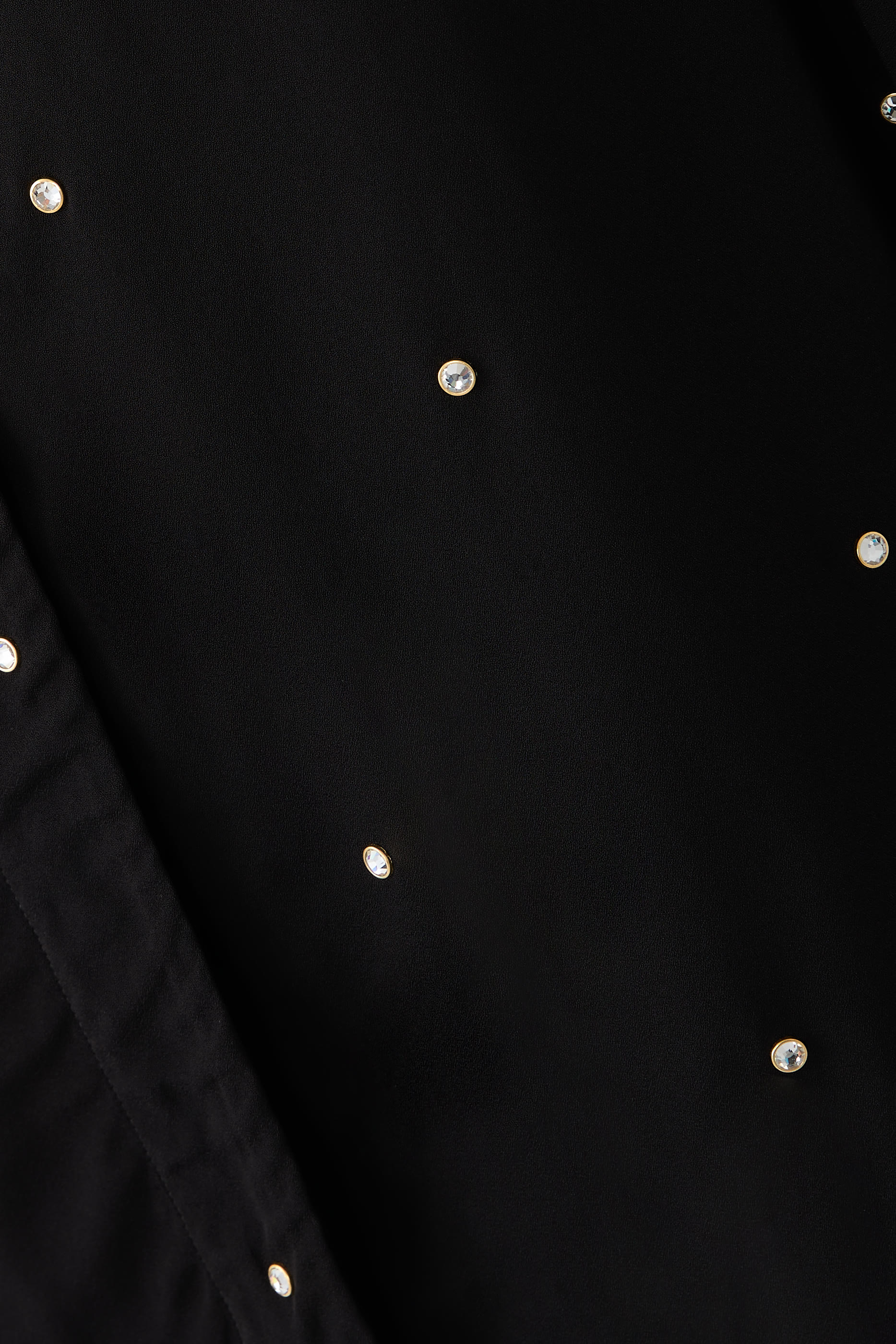 قميص بقصة فضفاضة مزين بالكريستال