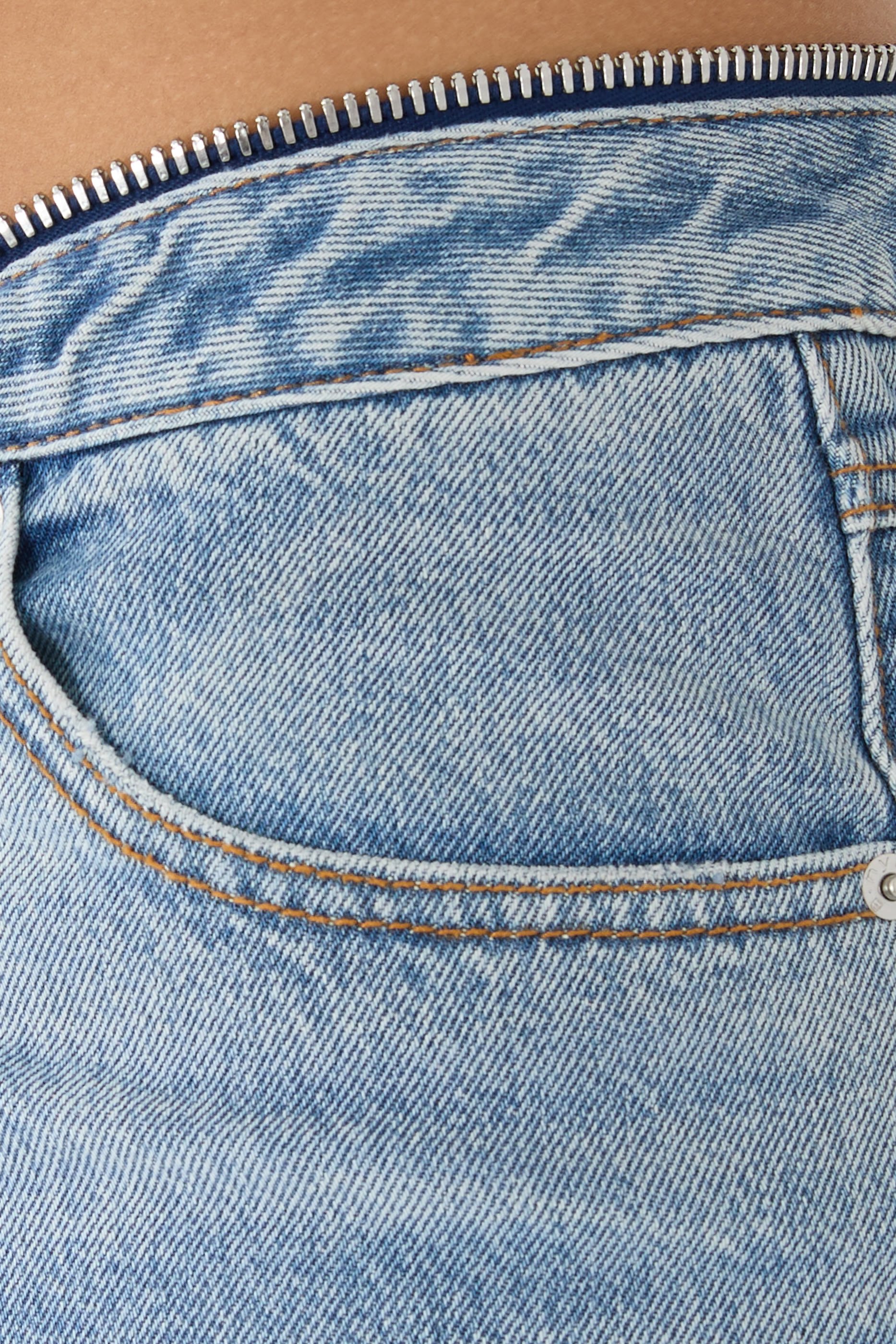 بنطال جينز بخصر V وسحاب