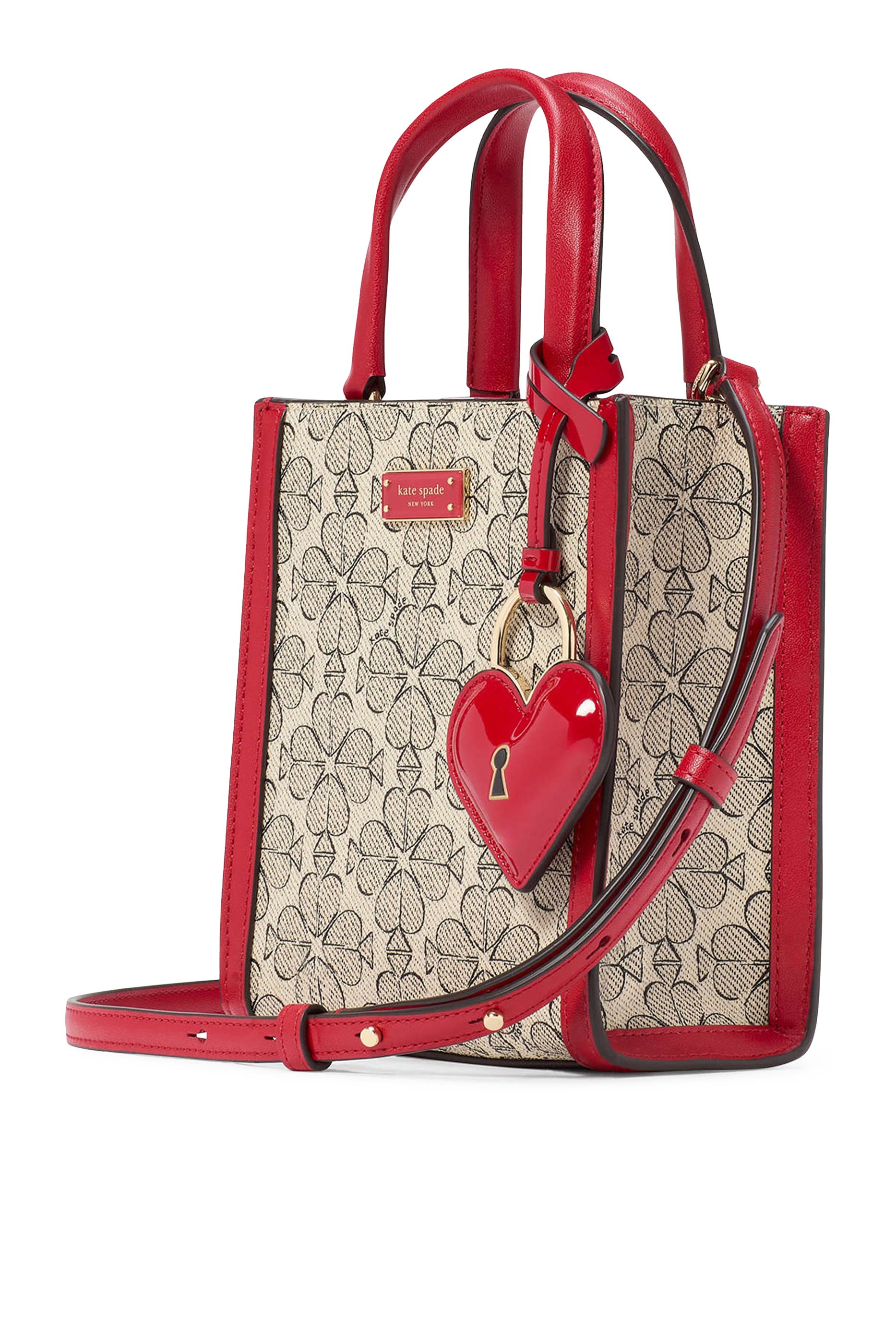 حقيبة يد صغيرة بنقشة زهور بالشكل البستوني