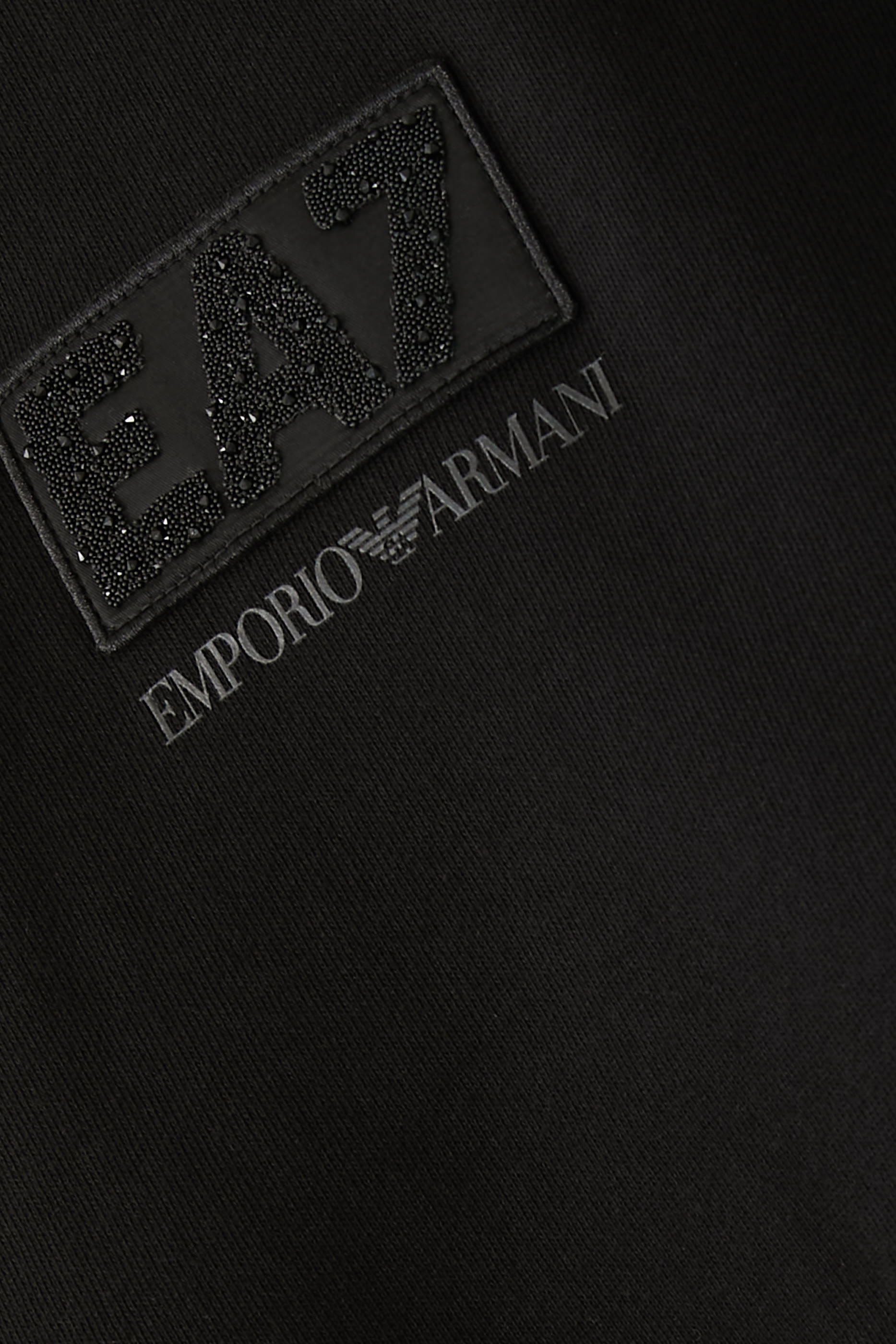 بنطال بقصة ساق واسعة بشعار الماركة