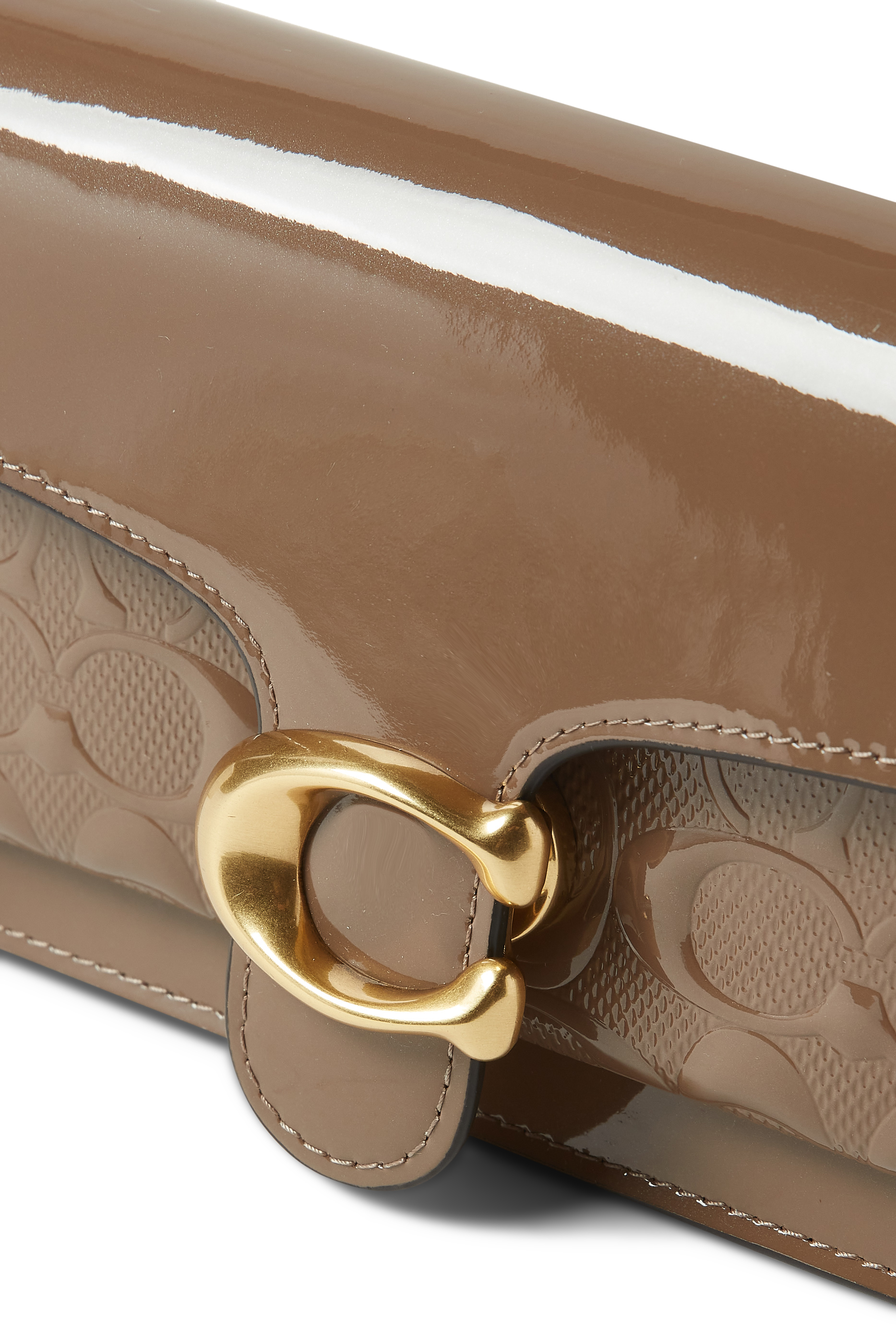 كلاتش تابي جلد لامع بنقشة شعار الماركة