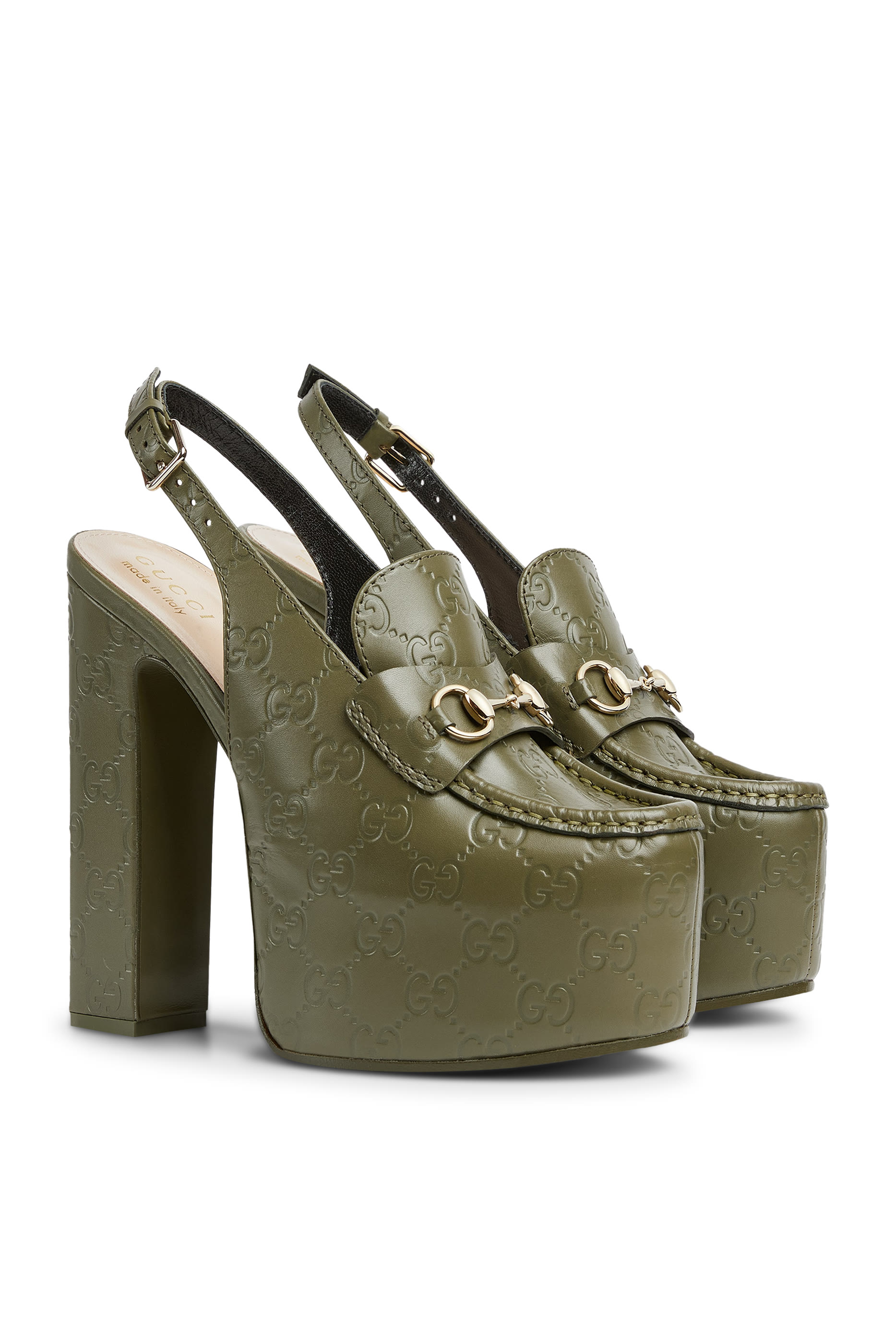 حذاء كلاسيك 145 بنعل سميك بسير خلفي وحلية بشعار الماركة