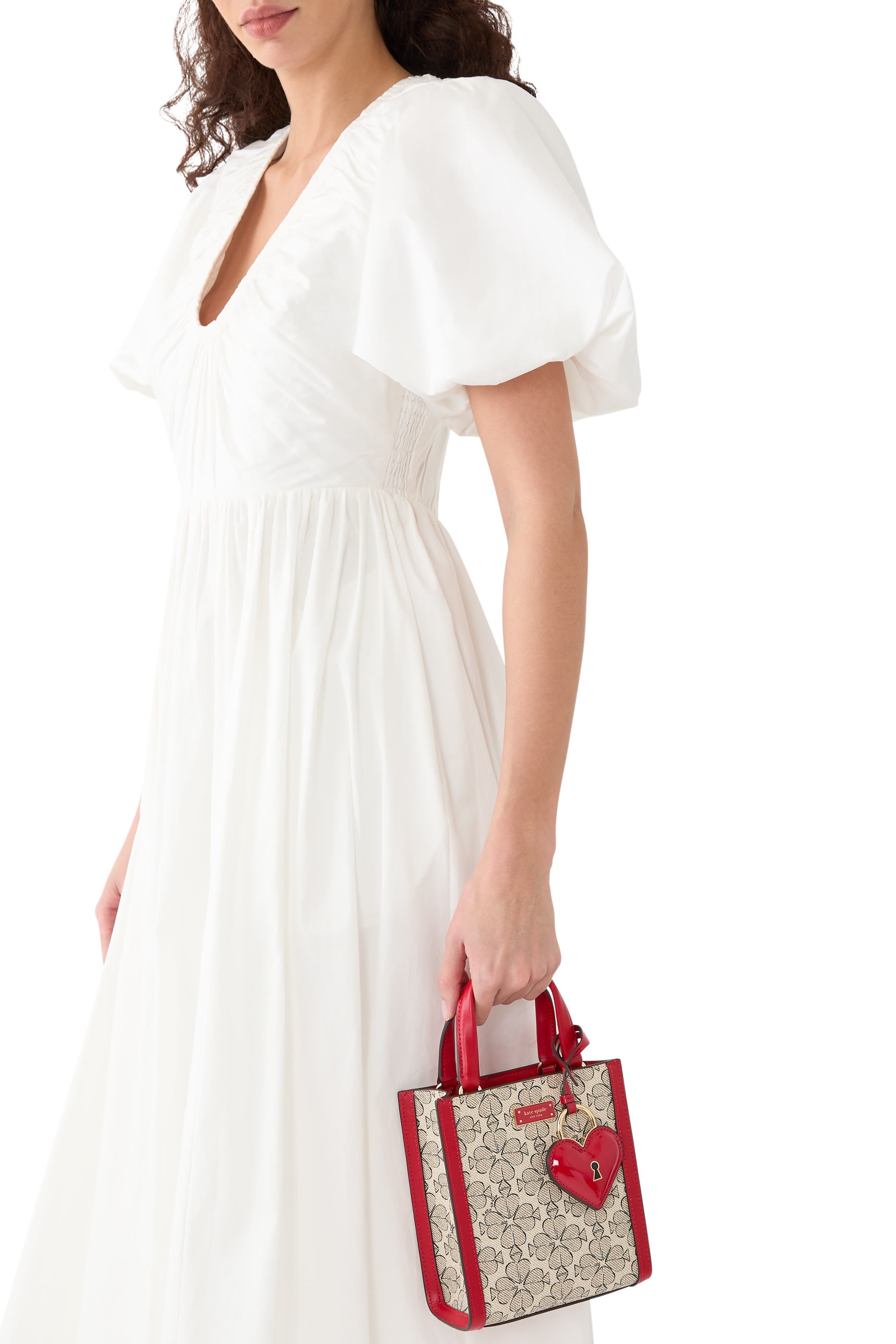 حقيبة يد صغيرة بنقشة زهور بالشكل البستوني