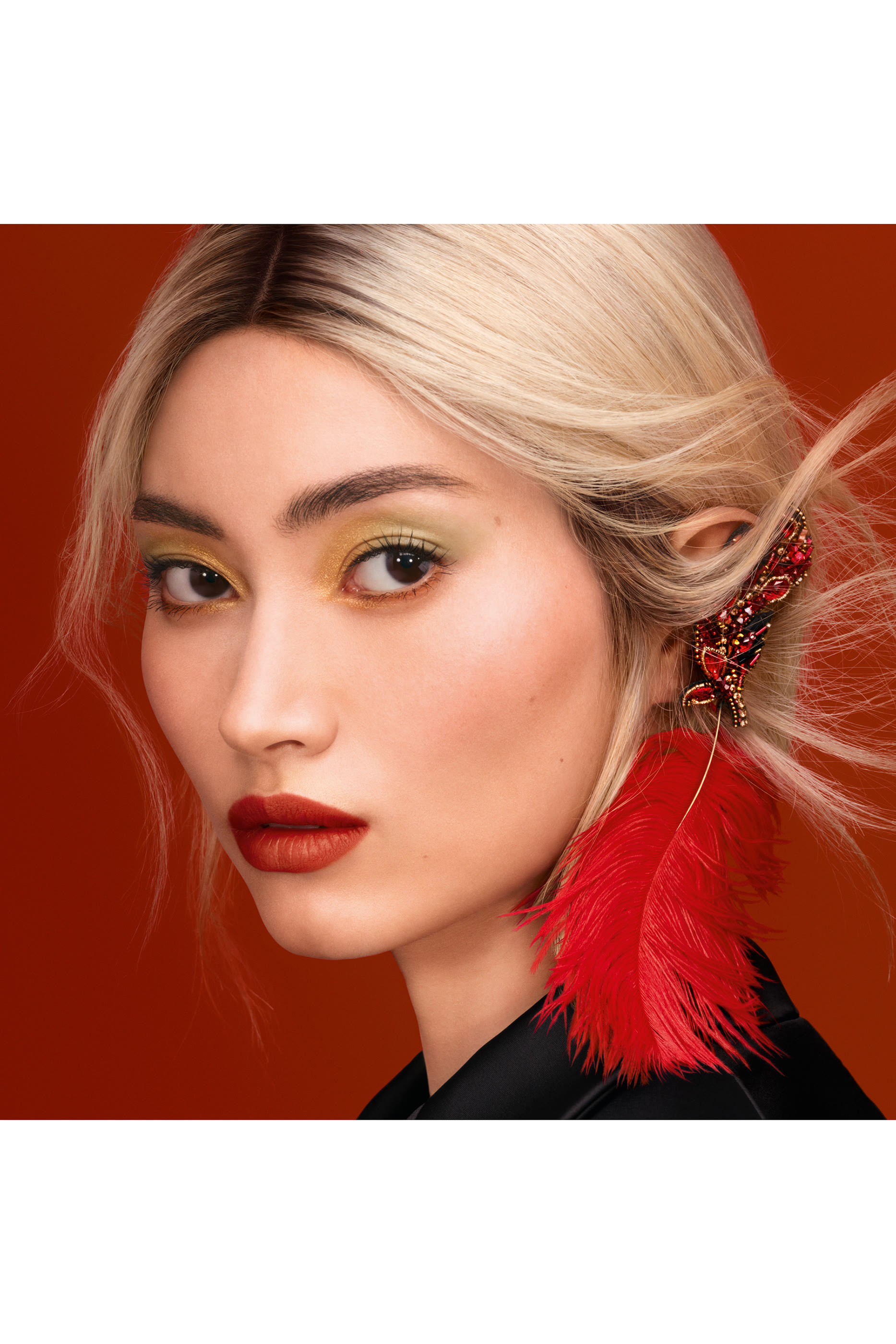 عبوة أحمر شفاه روج جي بنقشة ريش طائر العنقاء