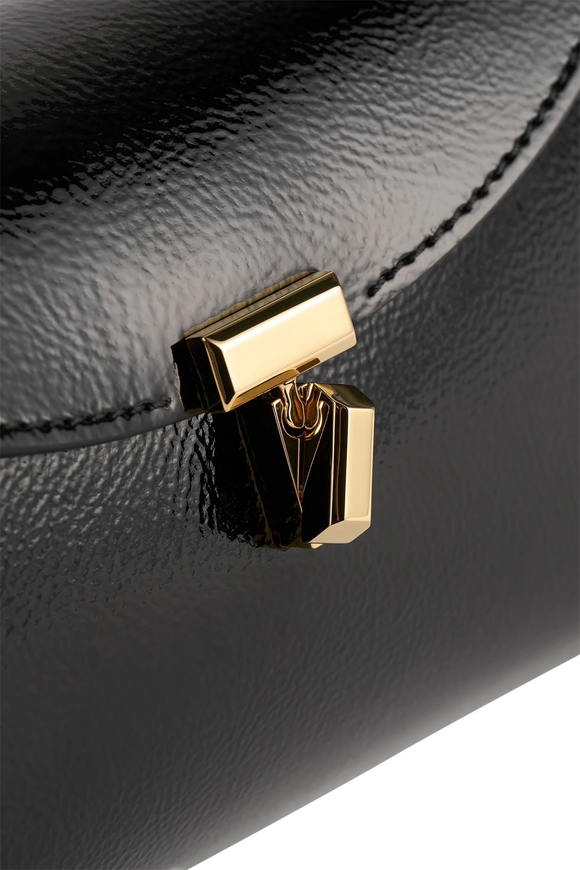 كلاتش نابلاك صغير بإغلاق على شكل حرف T 