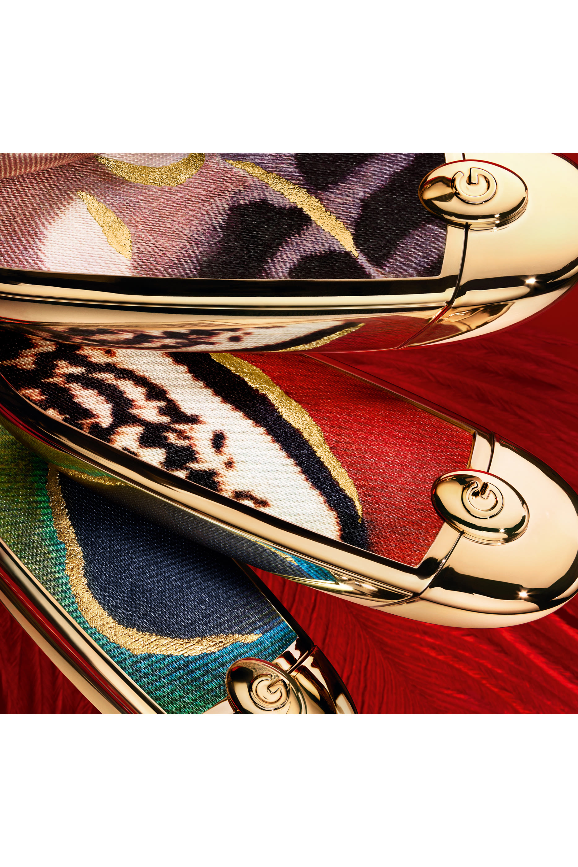 عبوة أحمر شفاه روج جي بنقشة ريش طائر العنقاء