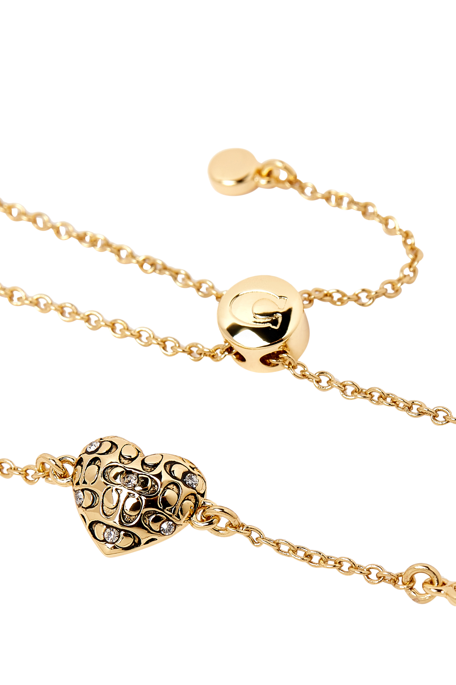 سوار بمشبك متحرك وحلية بتصميم قلب محفور بشعار الماركة بنمط مبطن