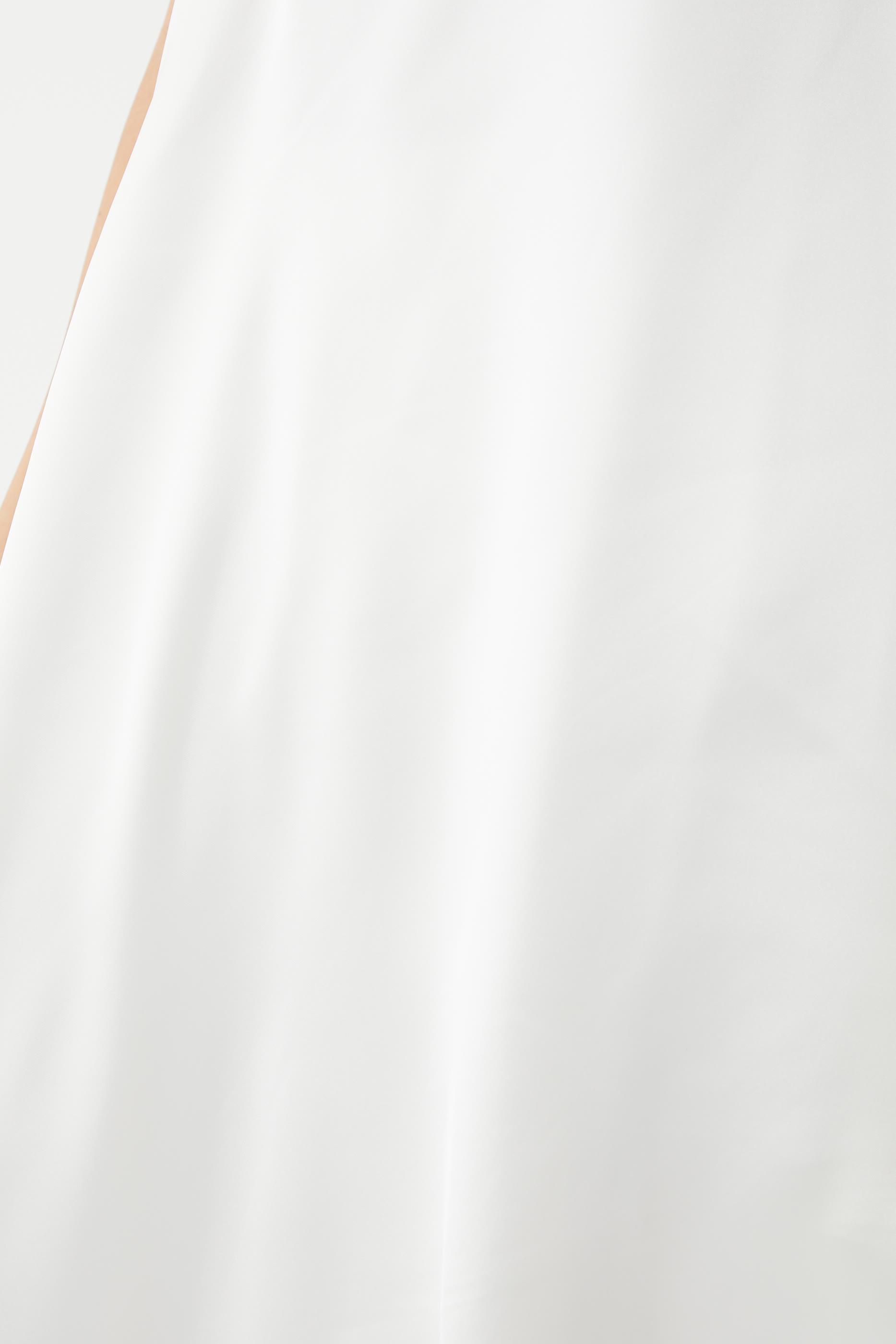 تونيك بكتف واحد وحافة مائلة