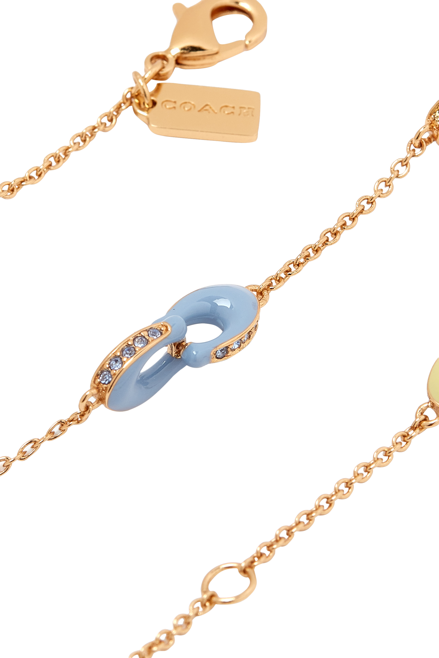 سوار بشعار الماركة مرصع بكريستال زجاجي ومزين بمينا، نحاس