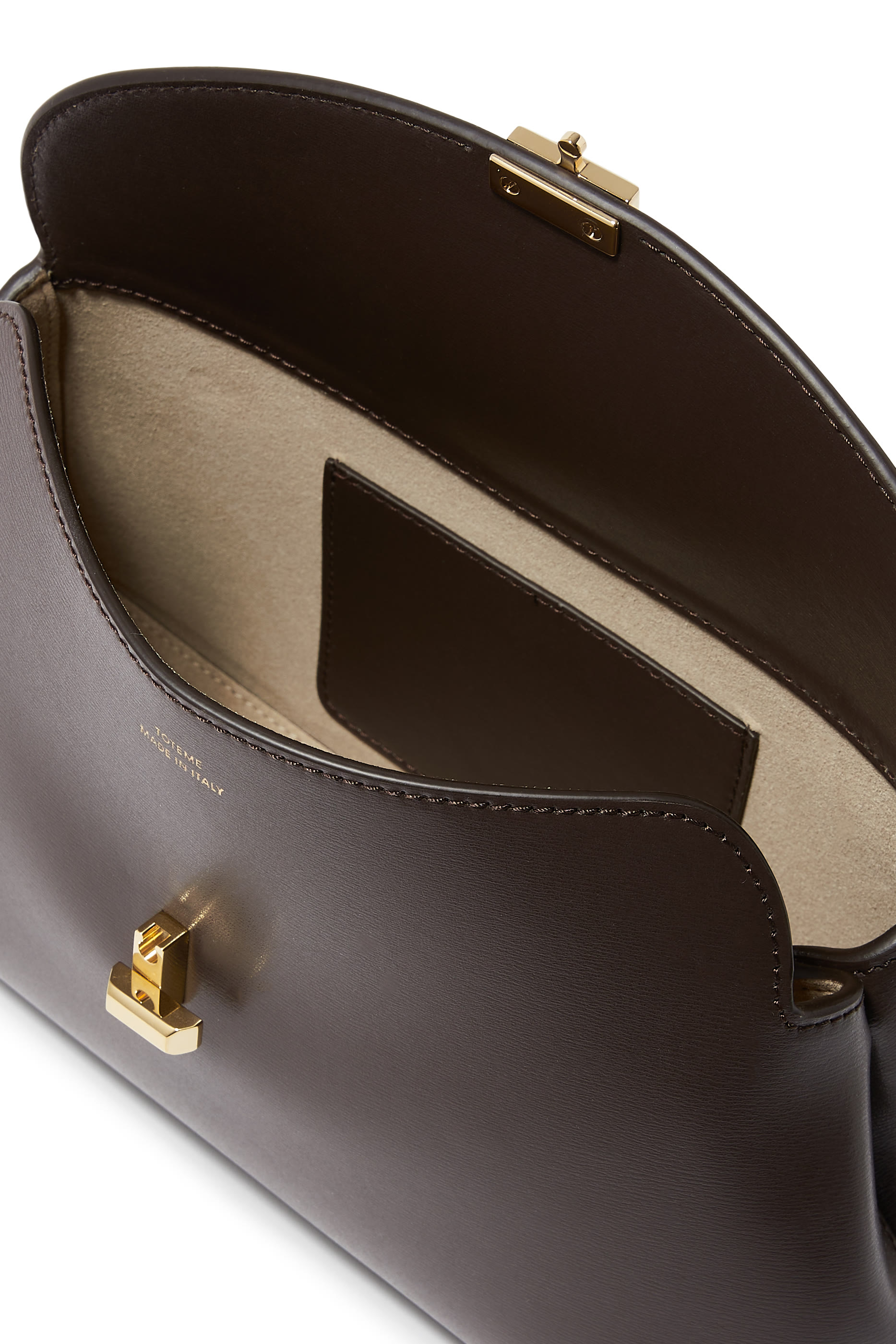 حقيبة كلاتش بقفل على شكل حرف T جلد