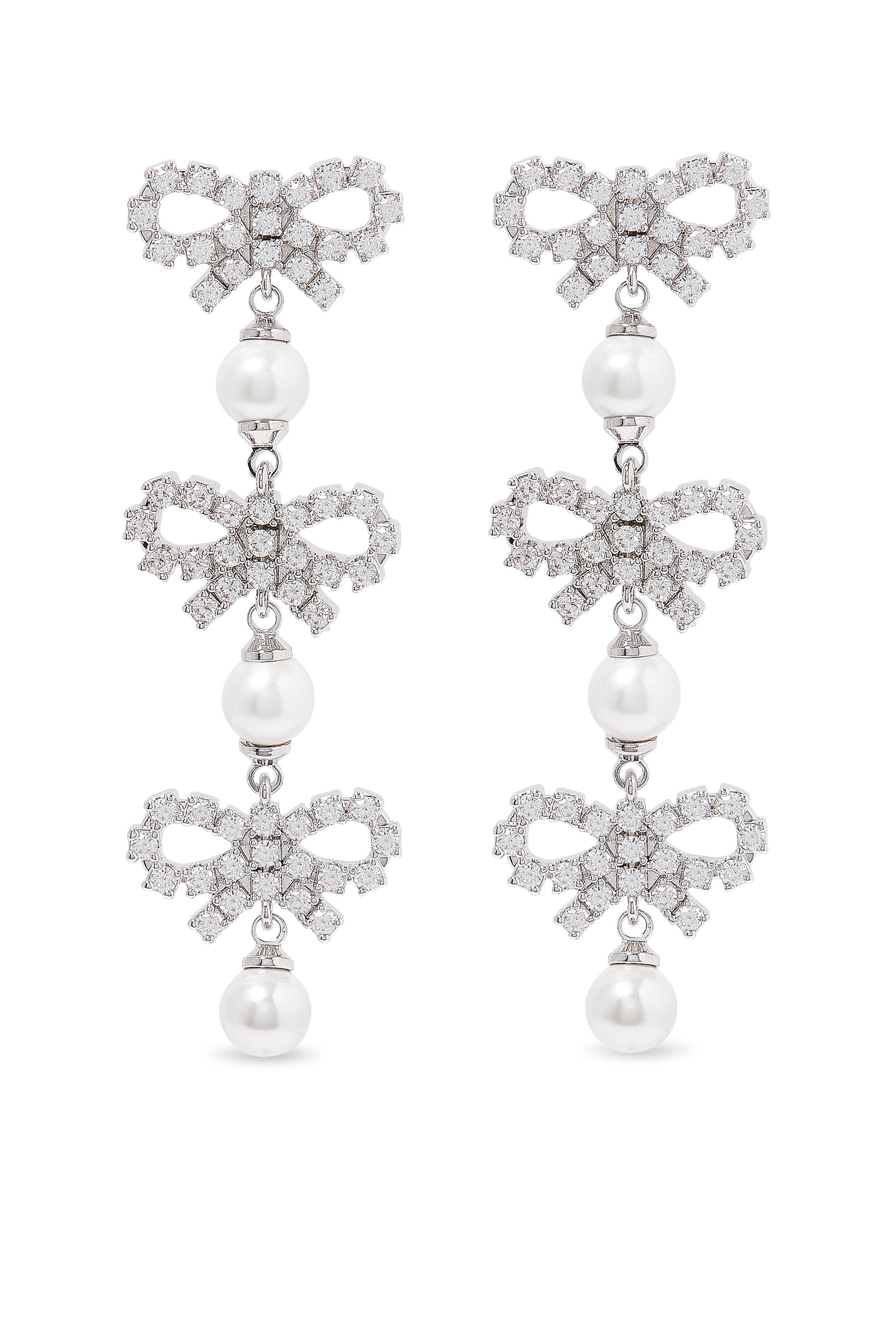 أقراط بتصميم متدرج بفيونكة صغيرة مرصعة بكريستال