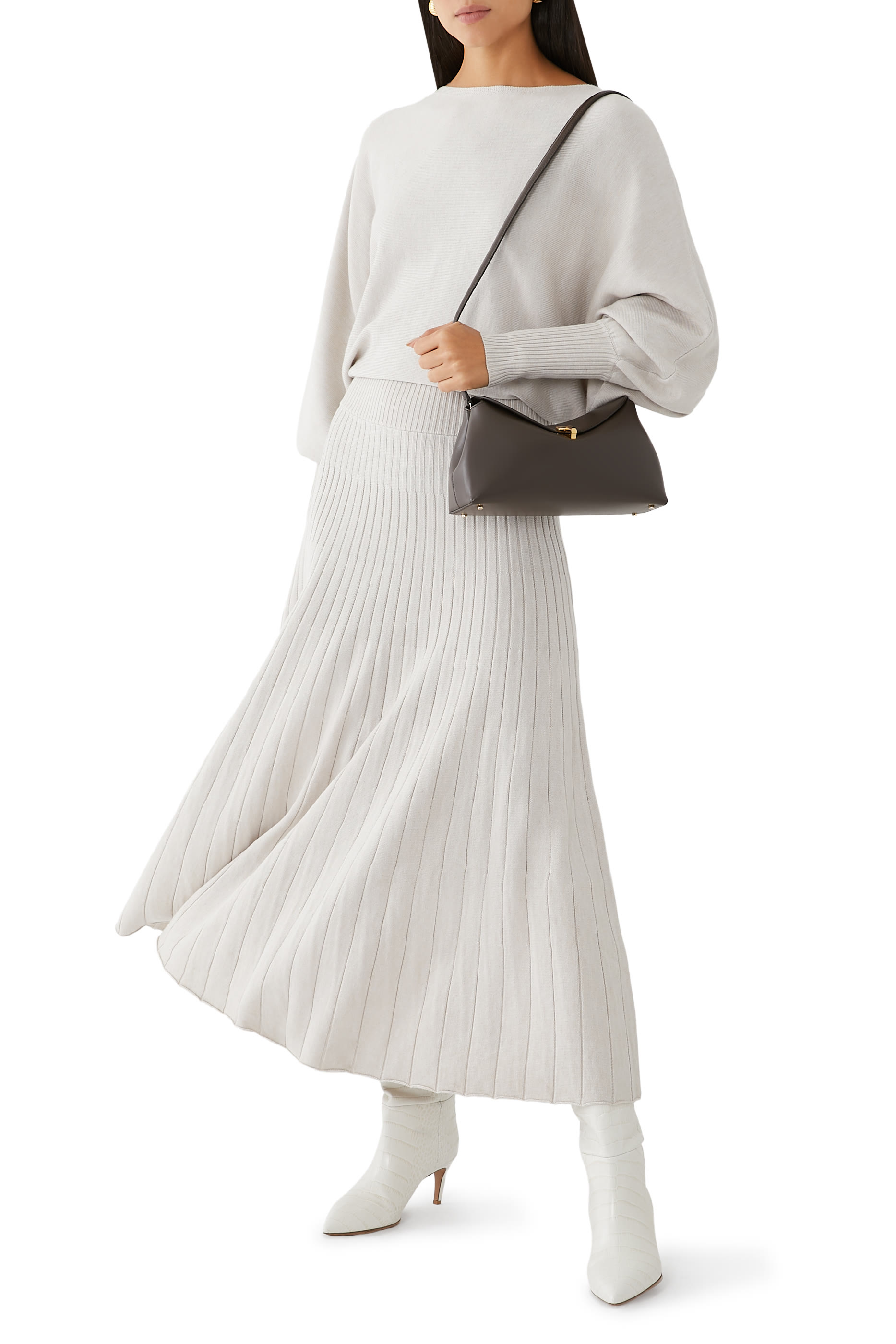 حقيبة كلاتش بقفل على شكل حرف T جلد