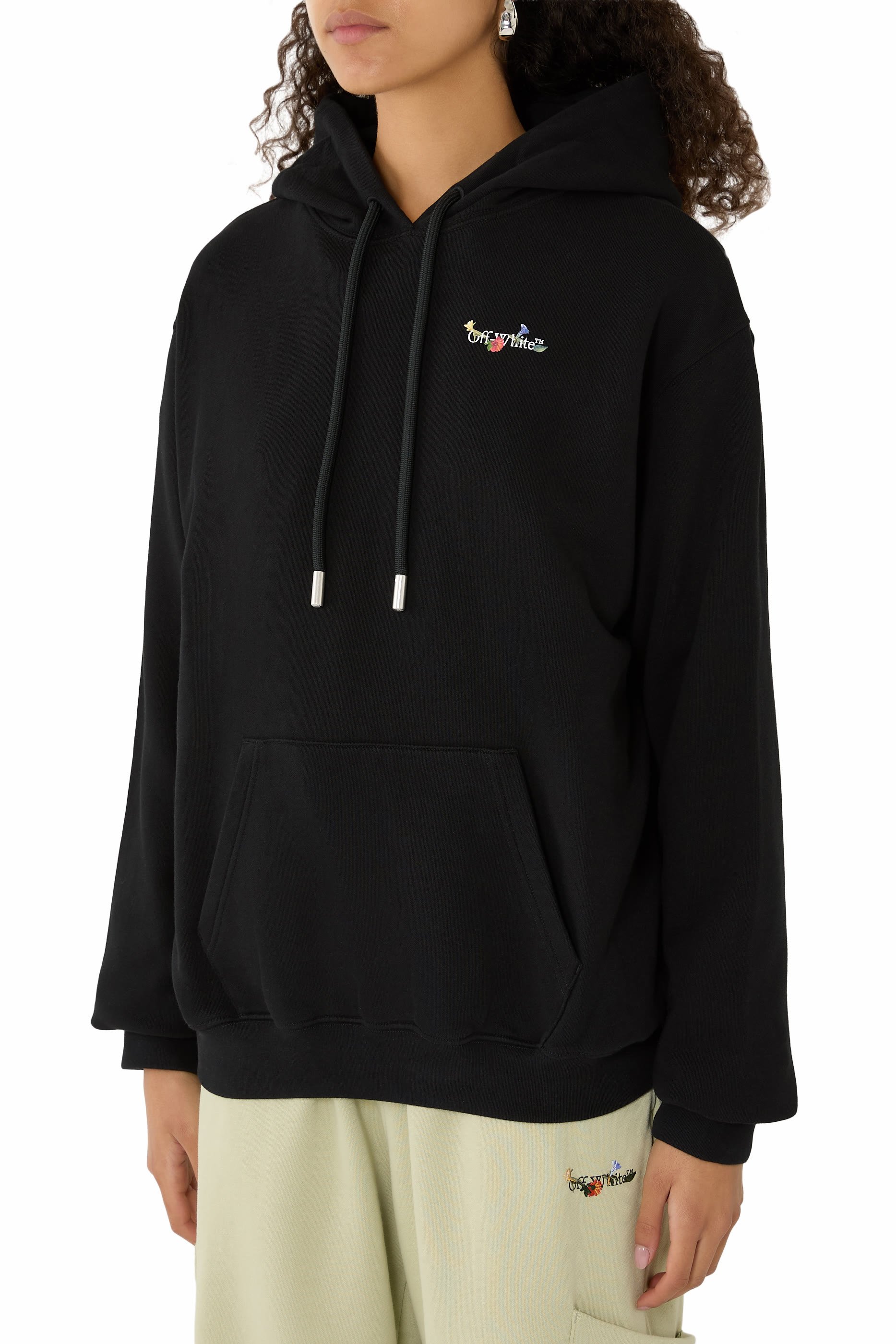 هودي بجيب بنقشة أزهار وشعار السهم