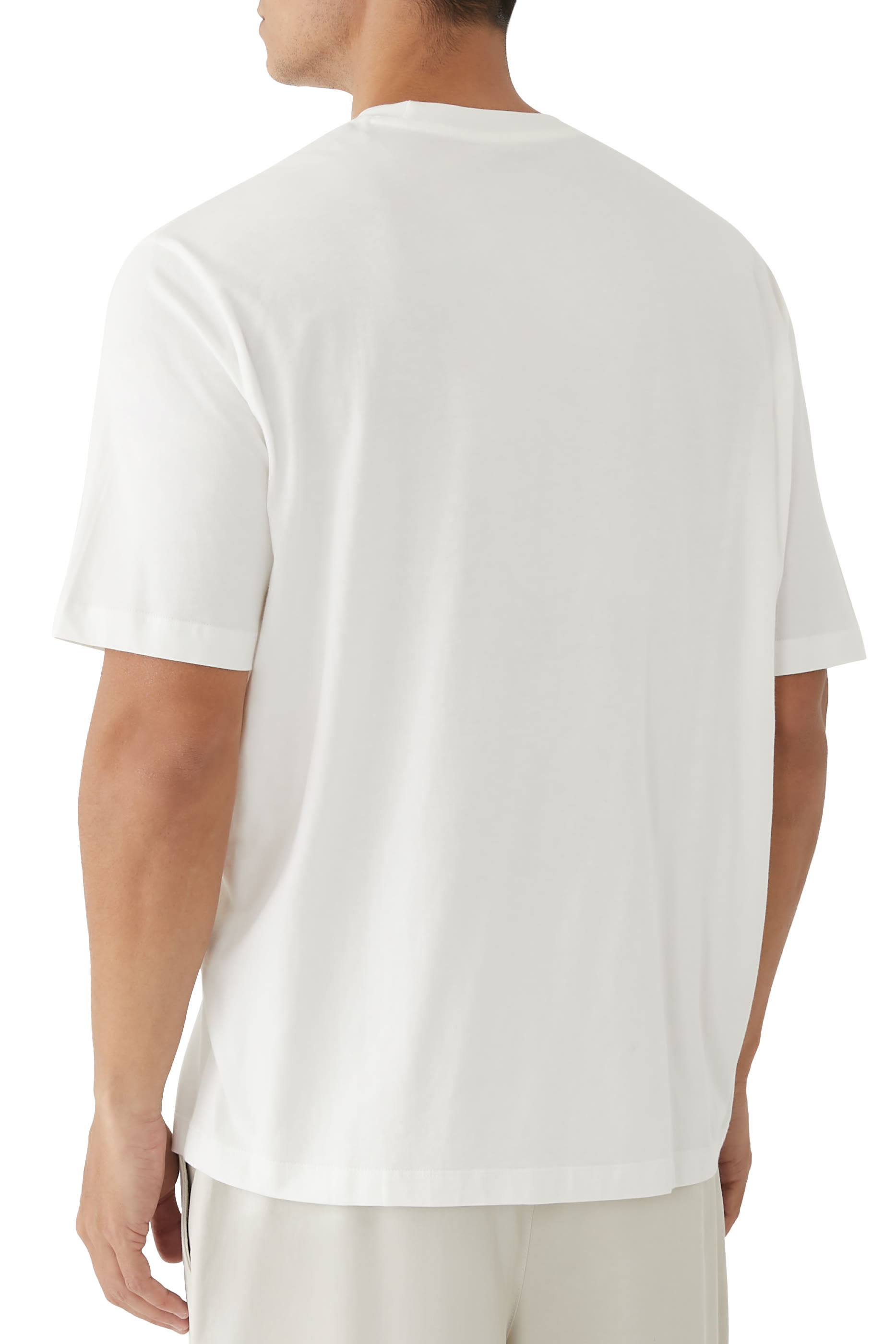 تيشيرت بنقشة شعار الماركة وشجر نخيل